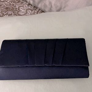 Navy blue clutch bag, has an elegant should strap as well.  Goes with Nina heels
